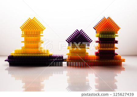 The developmental children's construction toy consists of bright parts that easily connect. The white background emphasizes the intensity of each color. The developmental children's construction toy consists of bright parts that easily connect. The white background emphasizes the intensity of each color. 125627439