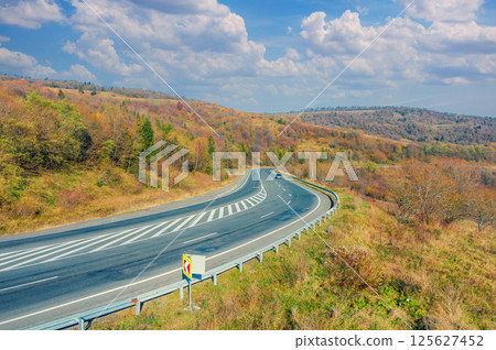 Winding highway in the autumn mountains. Drone view. Beautiful natural landscape. The Carpathians. Ukraine 125627452