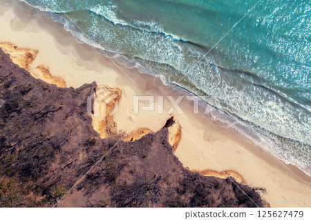 Top view of the seascape. Sea and clay steep coast in autumn Ukraine, Europe 125627479