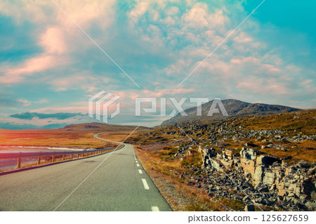 Driving a car on mountain road. Nature Norway. Polar circle. The way to Nordkapp 125627659