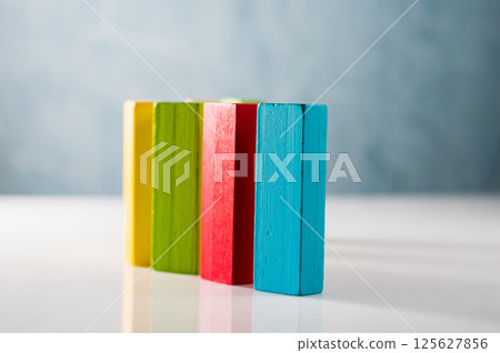 The image shows wooden blocks used as developmental material. These wooden sticks are part of an educational method for children. The image shows wooden blocks used as developmental material. These wooden sticks are part of an educational method for children. 125627856