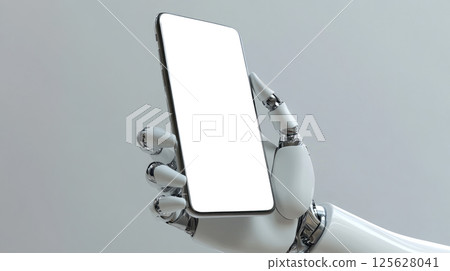 A hand of the robot with a smartphone with white screen. 125628041
