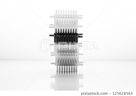 The black and white children's construction set emphasizes the geometry of shapes and textures. The play blocks are laid out on a light background, creating a calm visual effect. 125628563