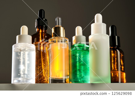 Lots of different face serums in the sun. Lots of different face serums in the sun. 125629098