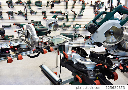 Electric saws in tool store 125629853