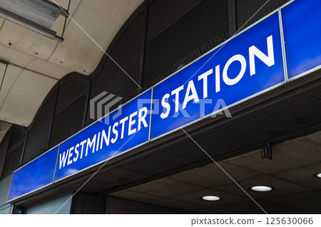 Westminster Station entrance sign in London with iconic blue and white design Westminster Station entrance sign in London with iconic blue and white design 125630066