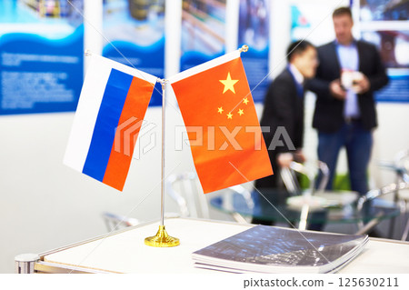 Flags of China and Russia at business exhibition Flags of China and Russia at business exhibition 125630211