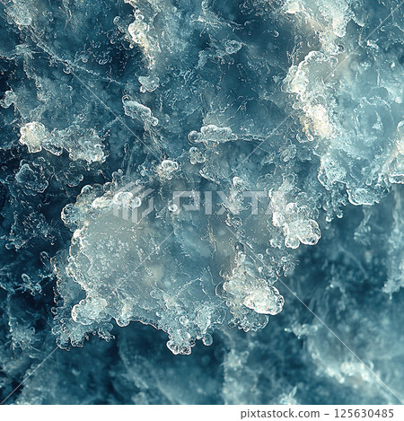Intricate ice crystals form a stunning natural abstract in captivating shades of blue and white. 125630485