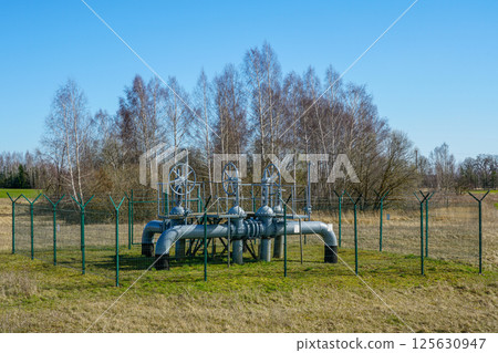 Fenced gas pipeline pipe valve station for gas transmission in rural area Fenced gas pipeline pipe valve station for gas transmission in rural area 125630947