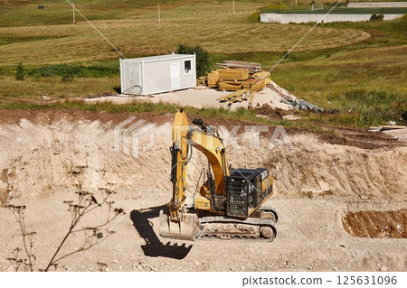 Construction site excavator and truck Construction site excavator and truck 125631096
