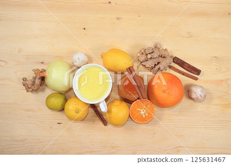 Latte with golden turmeric with ginger root, cinnamon, turmeric, lemon, spices for Ayurvedic medicine. The concept of alternative medicine, a means to increase immunity with coronovirus Latte with golden turmeric with ginger root, cinnamon, turmeric, lemon, spices for Ayurvedic medicine. The concept of alternative medicine, a means to increase immunity with coronovirus 125631467