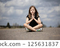 Little beautiful girl praying in nature. Hands folded in prayer. Religion concept 125631837