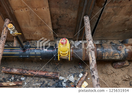 Construction site utility pipes hole 125631934