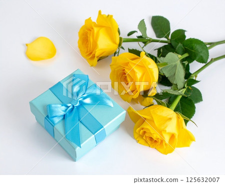 Father's Day image of yellow roses and gift box on white background 125632007