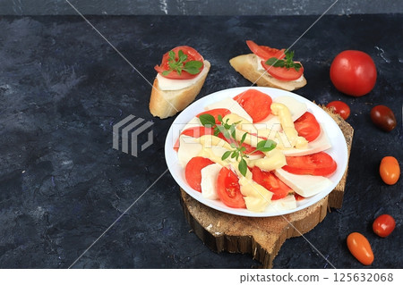 Caprese and Toast bruschetta with mozzarella cheese, cherry tomatoes and fresh garden basil. Traditional Italian food, healthy natural breakfast, cholesterol and GMO free, space for text, selective Caprese and Toast bruschetta with mozzarella cheese, cherry tomatoes and fresh garden basil. Traditional Italian food, healthy natural breakfast, cholesterol and GMO free, space for text, selective 125632068