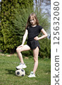 Girls playing with a soccer ball 125632080