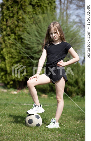 Girls playing with a soccer ball 125632080