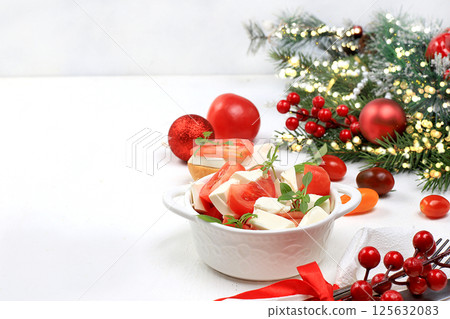 Caprese and toast with mozzarella cheese, cherry tomatoes and fresh garden Basil, Christmas and new year's food.Traditional Italian food, healthy natural Breakfast, cholesterol-free and GMO-free, Caprese and toast with mozzarella cheese, cherry tomatoes and fresh garden Basil, Christmas and new year's food.Traditional Italian food, healthy natural Breakfast, cholesterol-free and GMO-free, 125632083