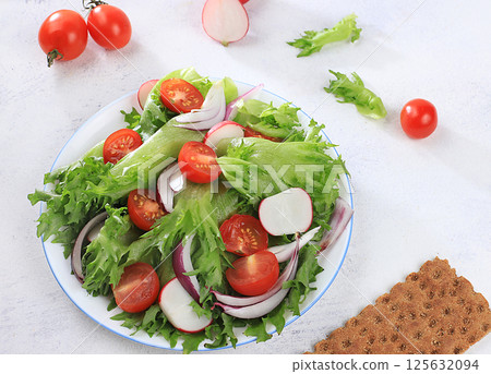 Vegetable salad with cherry tomatoes, onions, radishes and fresh arugula, Healthy natural breakfast for a dietary lifestyle, detox diet Balanced food without cholesterol and GMO, selective focus, Vegetable salad with cherry tomatoes, onions, radishes and fresh arugula, Healthy natural breakfast for a dietary lifestyle, detox diet Balanced food without cholesterol and GMO, selective focus, 125632094