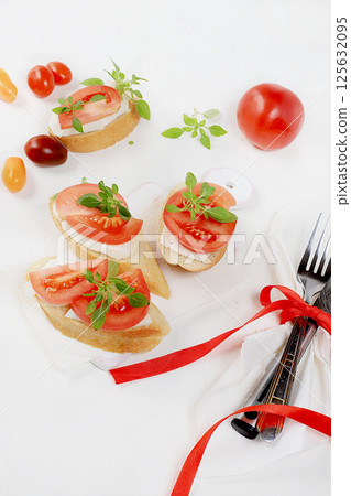 Caprese and Toast bruschetta with mozzarella cheese, cherry tomatoes and fresh garden basil. Traditional Italian food, healthy natural breakfast, cholesterol and GMO free, space for text, selective Caprese and Toast bruschetta with mozzarella cheese, cherry tomatoes and fresh garden basil. Traditional Italian food, healthy natural breakfast, cholesterol and GMO free, space for text, selective 125632095