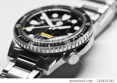 Macro image highlighting a luxury black wristwatch 125632291