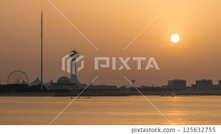 Sunset in Abu Dhabi over Marina Island timelapse 125632755