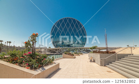 Circular skyscraper Aldar Headquarters Building timelapse hyperlapse in Abu Dhabi, UAE. Circular skyscraper Aldar Headquarters Building timelapse hyperlapse in Abu Dhabi, UAE. 125632802