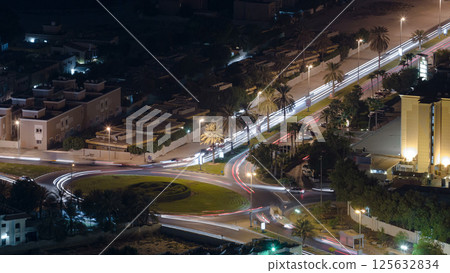 Cityscape of Ajman from rooftop night aerial timelapse Cityscape of Ajman from rooftop night aerial timelapse 125632834