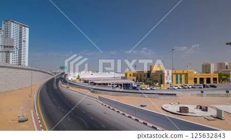 Road traffic in Ajman, view from bridge at day timelapse hyperlapse 125632843