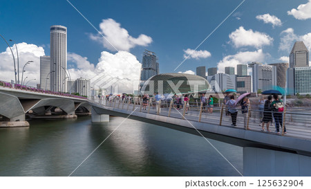 Esplanade Theatres domes behind Esplanade bridge near Esplanade Drive with traffic timelapse hyperlapse 125632904