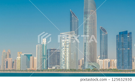 View of high skyscrapers on a corniche in Abu Dhabi stretching alongside the business center timelapse hyperlapse. 125632930