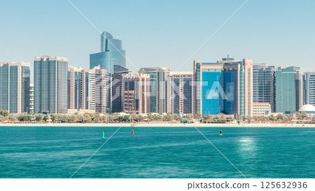 View of high skyscrapers on a corniche in Abu Dhabi stretching alongside the business center timelapse. View of high skyscrapers on a corniche in Abu Dhabi stretching alongside the business center timelapse. 125632936