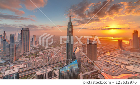 Amazing sunrise aerial view of Dubai downtown skyscrapers morning timelapse, Dubai, United Arab Emirates Amazing sunrise aerial view of Dubai downtown skyscrapers morning timelapse, Dubai, United Arab Emirates 125632970