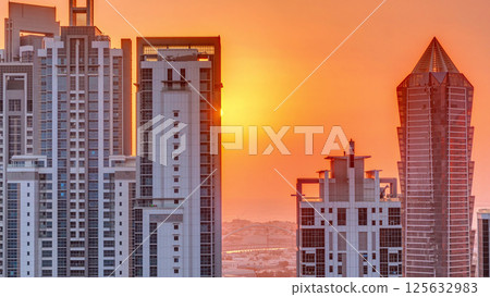 Sunset behind modern residential and office complex aerial timelapse at Business Bay, Dubai Sunset behind modern residential and office complex aerial timelapse at Business Bay, Dubai 125632983