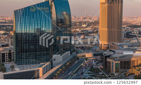 Dubai downtown street with busy traffic and skyscrapers around timelapse. 125632997