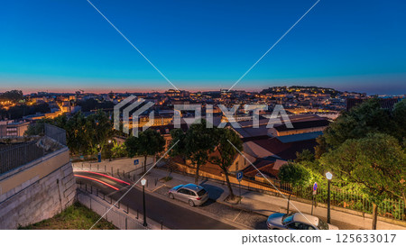 Lisbon aerial cityscape skyline night to day timelapse from viewpoint of St. Peter of Alcantara, Portugal 125633017