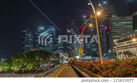 Business Financial Downtown City and Skyscrapers Tower Building at Marina Bay night timelapse hyperlapse, Singapore 125633077