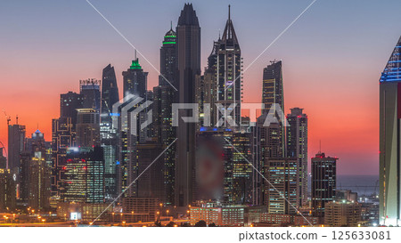 Dubai Marina skyscrapers and golf course day to night timelapse, Dubai, United Arab Emirates Dubai Marina skyscrapers and golf course day to night timelapse, Dubai, United Arab Emirates 125633081