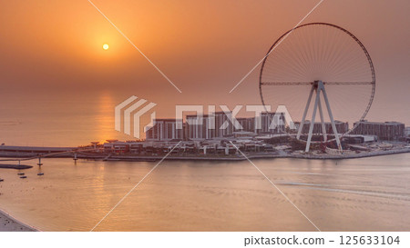 Sunset over Bluewaters Island in Dubai aerial timelapse. 125633104