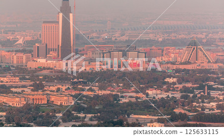 Aerial view of neighborhood Deira and Dubai creek with typical old and modern buildings timelapse. 125633115
