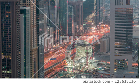 Construction site of the Museum of the Future aerial night to day timelapse, next iconic building of Dubai. 125633130