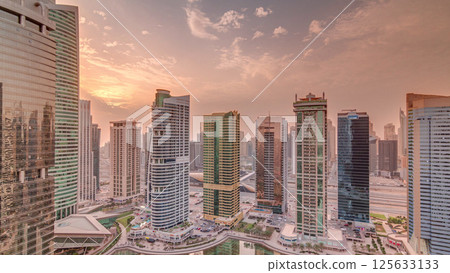 Residential and office buildings in Jumeirah lake towers district timelapse in Dubai Residential and office buildings in Jumeirah lake towers district timelapse in Dubai 125633133