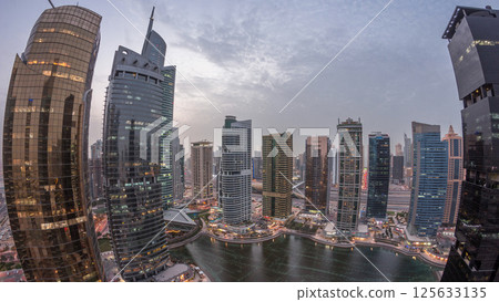 Residential and office buildings in Jumeirah lake towers district day to night timelapse in Dubai 125633135