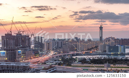 Palm Jumeirah Highway bridge aerial day to night timelapse. Dubai, United Arab Emirates Palm Jumeirah Highway bridge aerial day to night timelapse. Dubai, United Arab Emirates 125633150