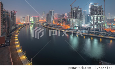 The rhythm of the city of Dubai from night to day transition aerial timelapse 125633158