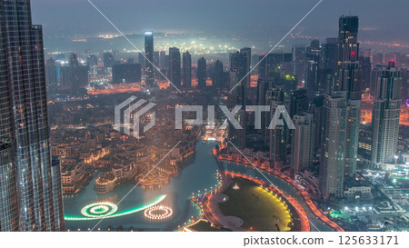 Amazing aerial view of Dubai downtown skyscrapers night to day timelapse, Dubai, United Arab Emirates Amazing aerial view of Dubai downtown skyscrapers night to day timelapse, Dubai, United Arab Emirates 125633171