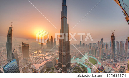 Panoramic skyline view of Dubai downtown during sunrise with mall, fountains and Burj Khalifa aerial morning timelapse Panoramic skyline view of Dubai downtown during sunrise with mall, fountains and Burj Khalifa aerial morning timelapse 125633174