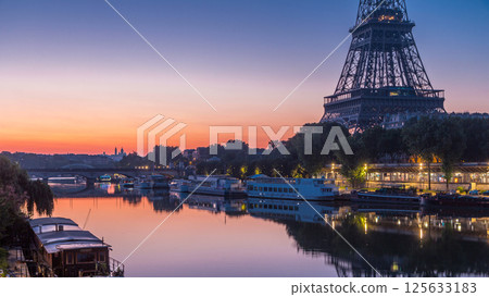 Eiffel Tower and the Seine river night to day timelapse, Paris, France Eiffel Tower and the Seine river night to day timelapse, Paris, France 125633183