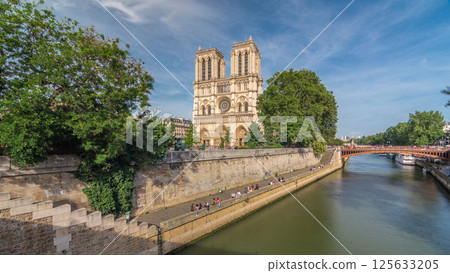 Front facade of cathedral of Notre Dame de Paris, with square full of people in front timelapse hyperlapse 125633205