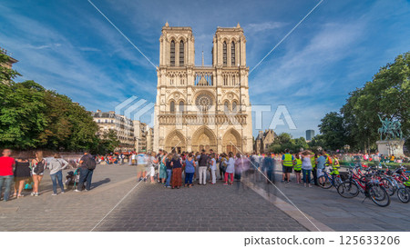 Front facade of cathedral of Notre Dame de Paris, with square full of people in front timelapse hyperlapse 125633206